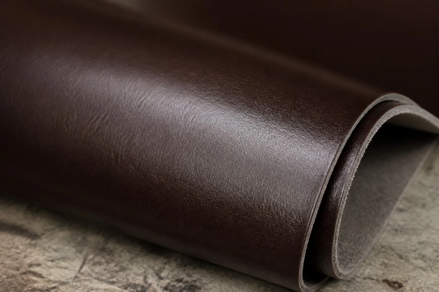 PU leather sheet with smooth synthetic surface on a factory workbench