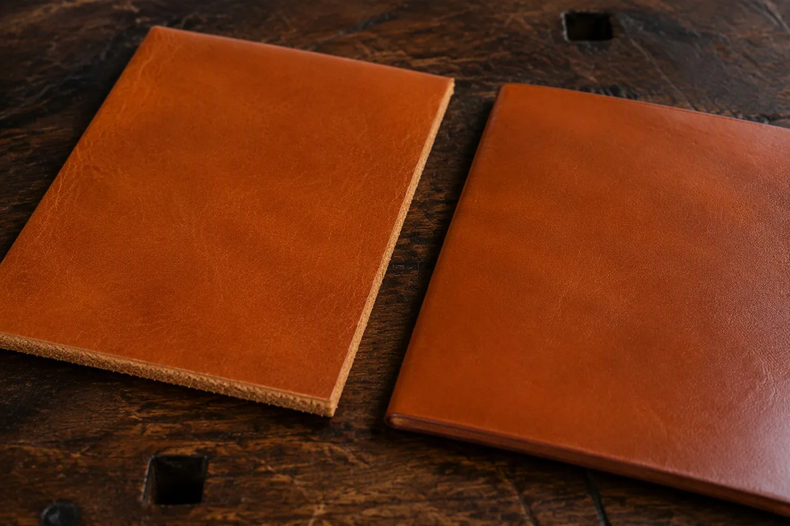 Two leather samples side by side, vegetable-tanned on the left and chrome-tanned on the right