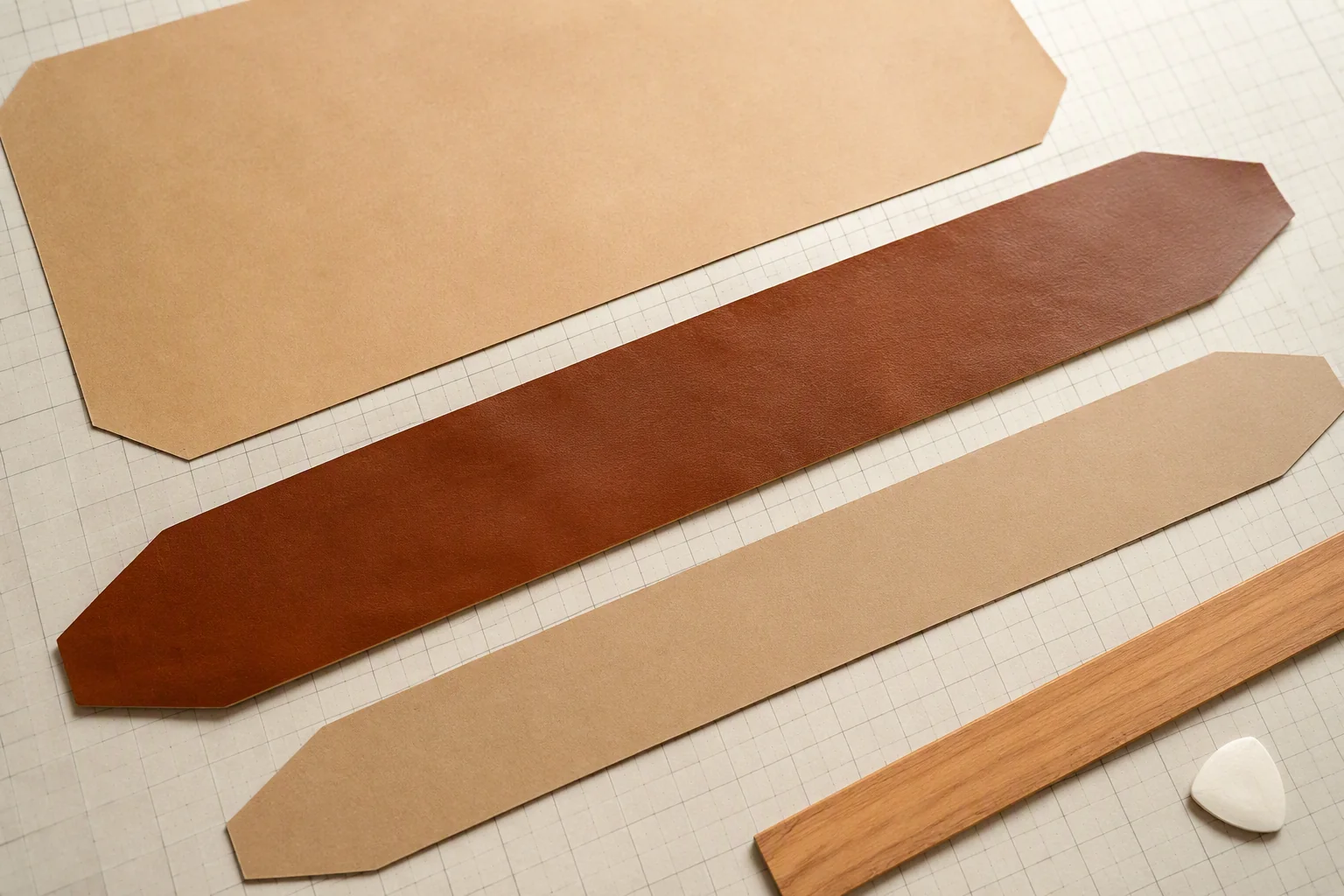 Pattern pieces with a long tapered gusset strip on a cutting table